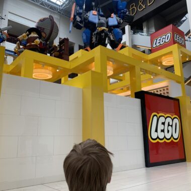 Boy in front of Lego Store at Mall of America.