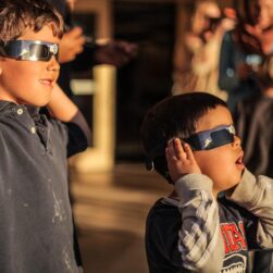 Kids wearing glasses for star party at Como Planetarium.