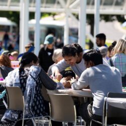 People at picnic tables at the walker.