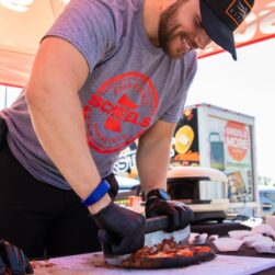 Scheels grill master cutting meat at Grill Fest.