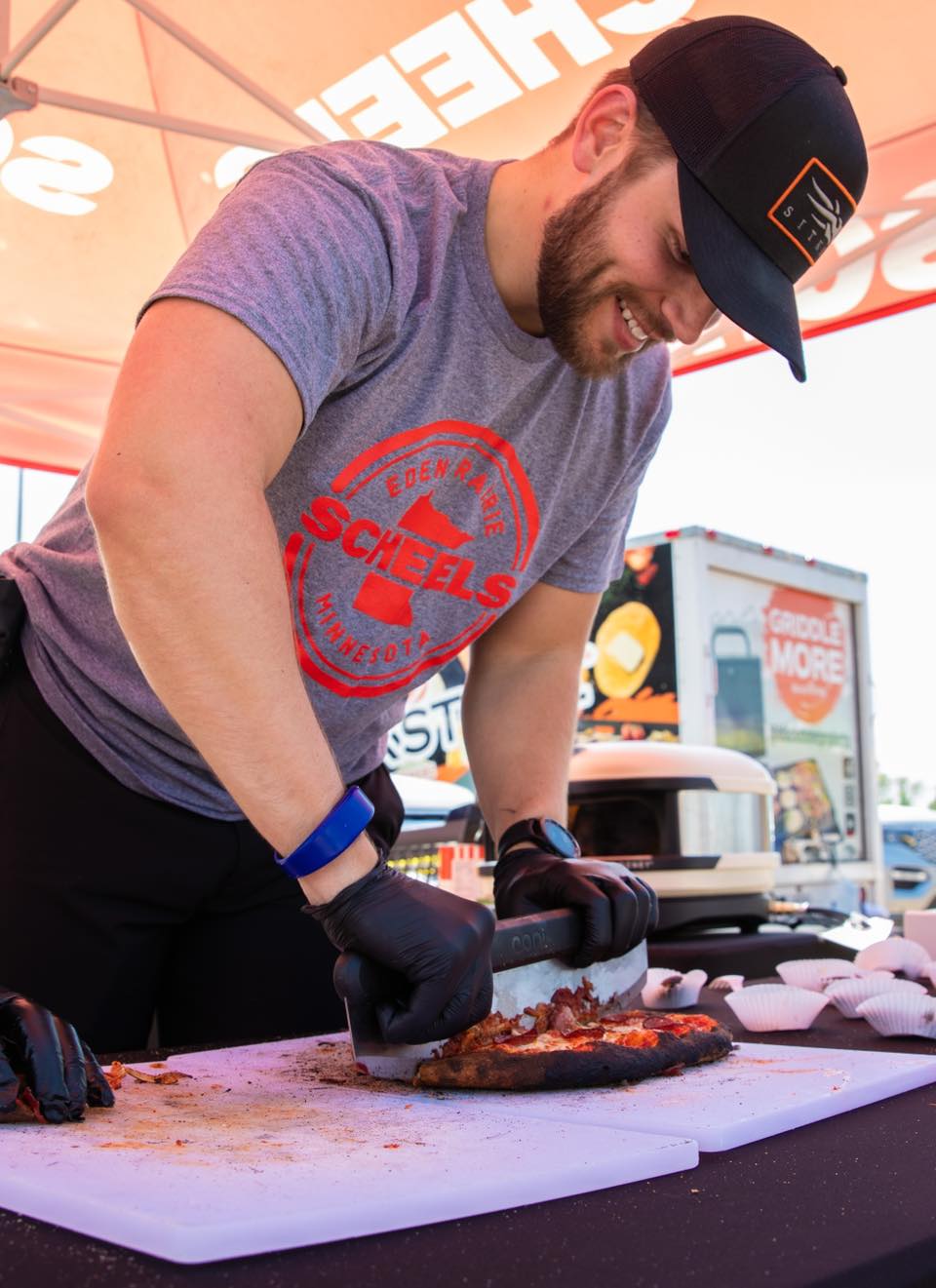 Scheels grill master cutting meat at Grill Fest.