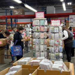 People shopping greeting cards at the Gina B Warehouse Sale.
