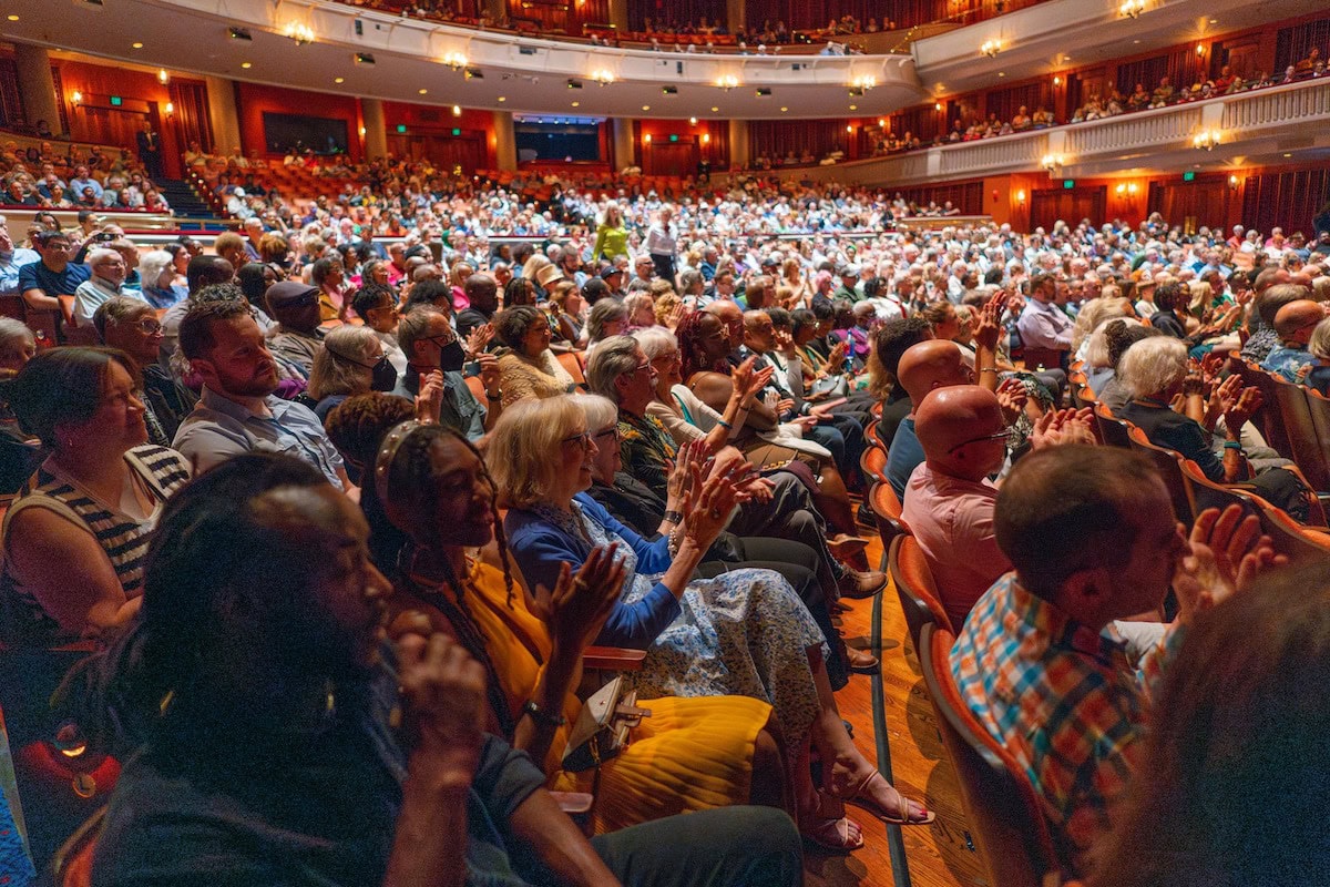 Audience members watching a performance at the ordway.