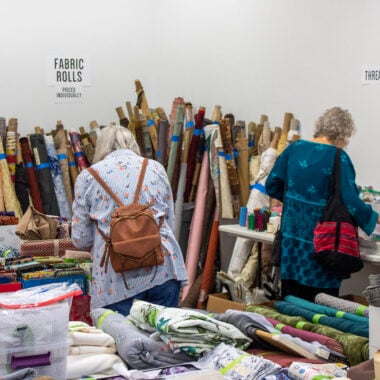Shoppers shopping at the Textile Garage Sale.