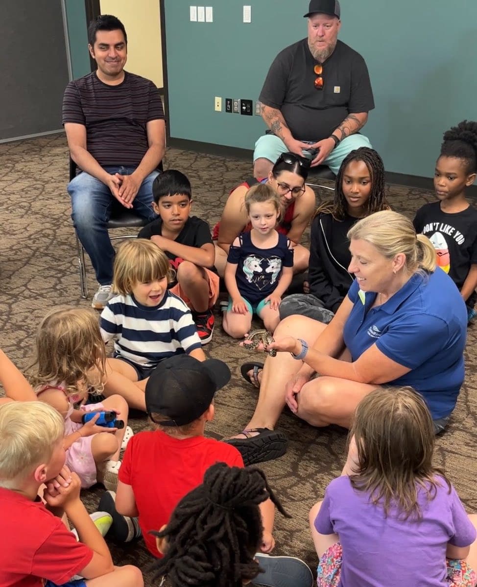 Group of people sitting with a naturalist.