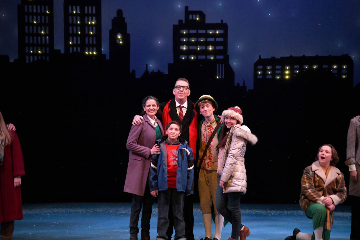 Actors posing on stage during Elf the Musical Jr.