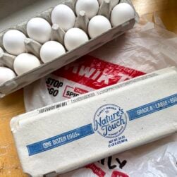 2 cartons of Kwik Trip eggs on top of Kwik Trip plastic shopping bag.