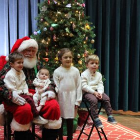 Kids visiting Santa at Landmark Center Santas Workshop in St. Paul.