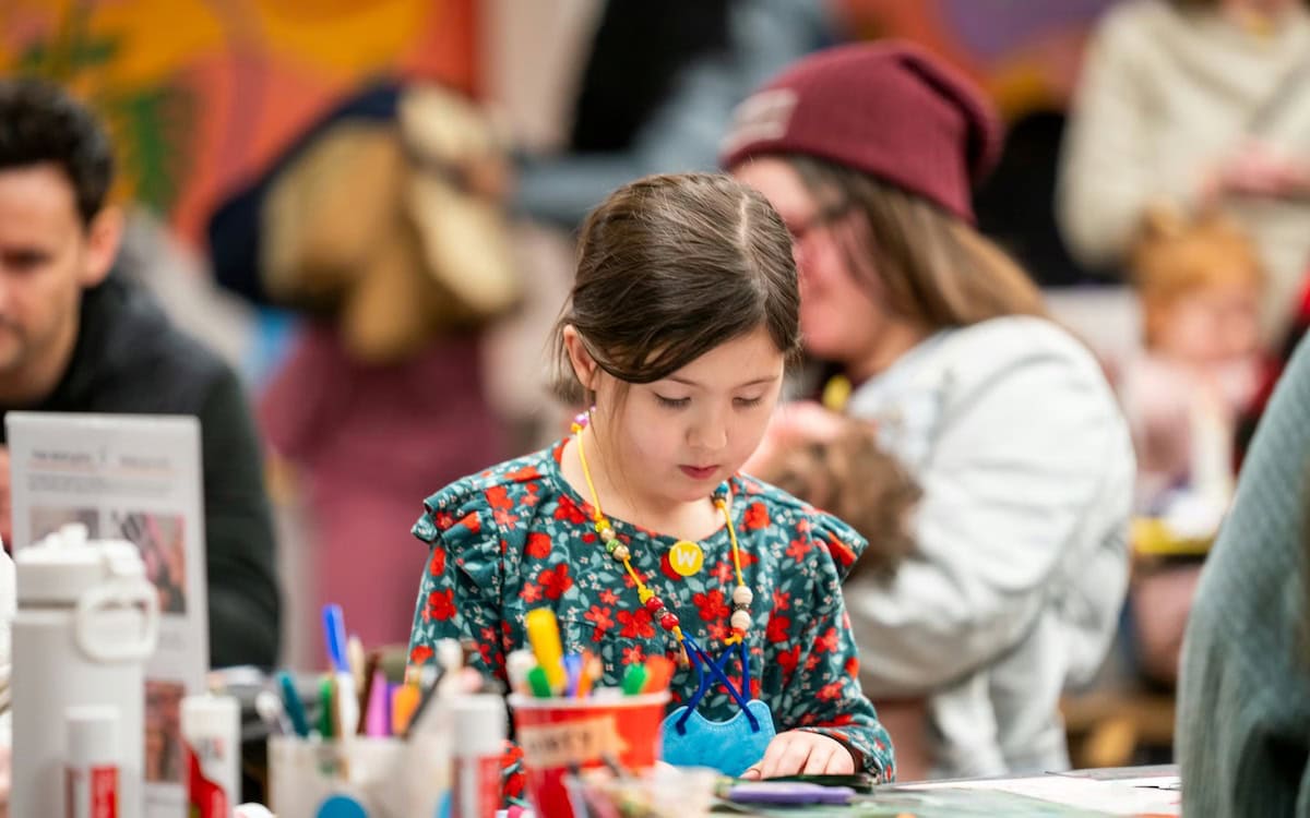 Girl crafting at table at the Walker Art Center