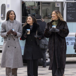 Friends with coffee on city street in Relationship Goals Movie.