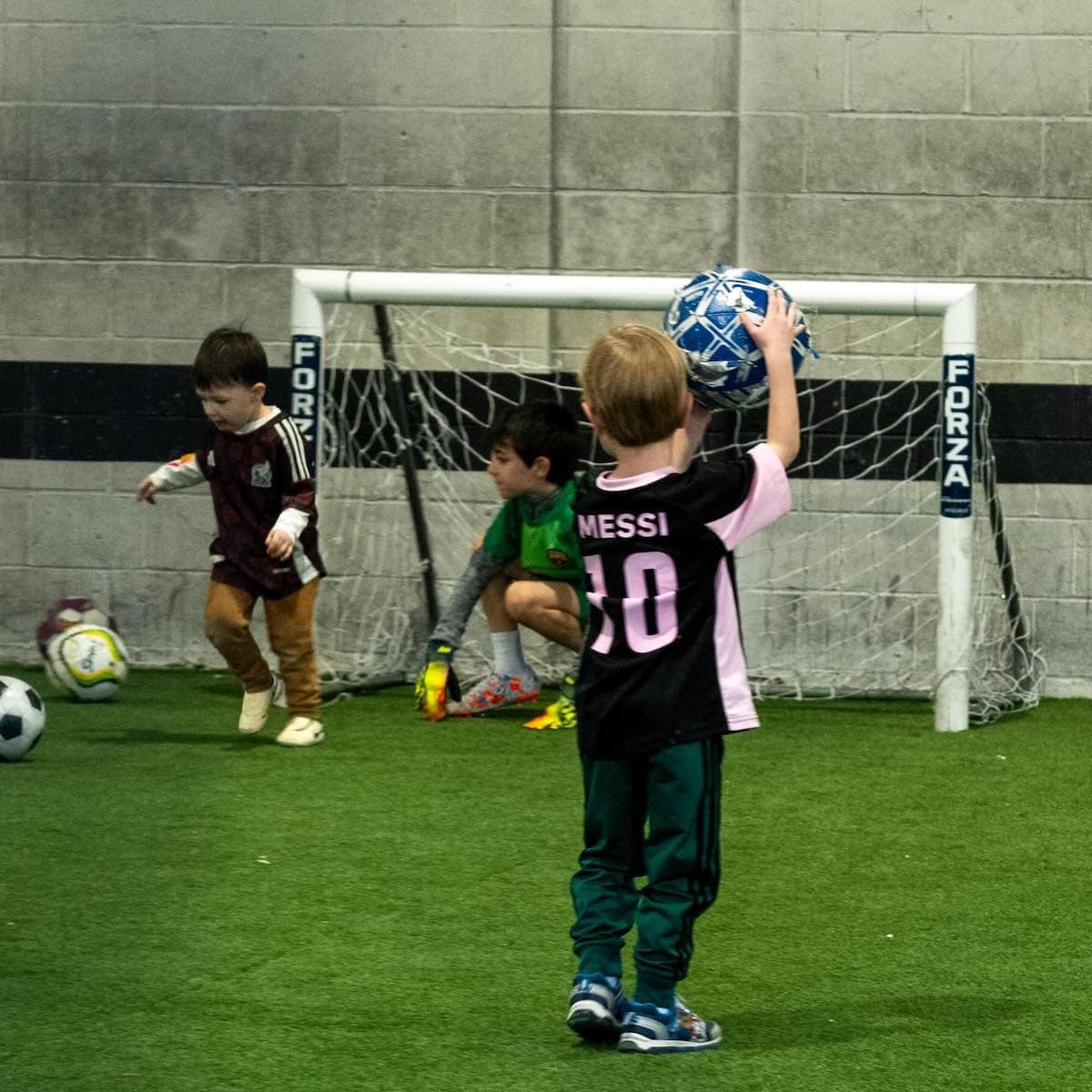 Kids playing soccer at Ninth Street Soccer and Coffee.