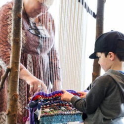 Kid trying the loom at Phipps Community Day.