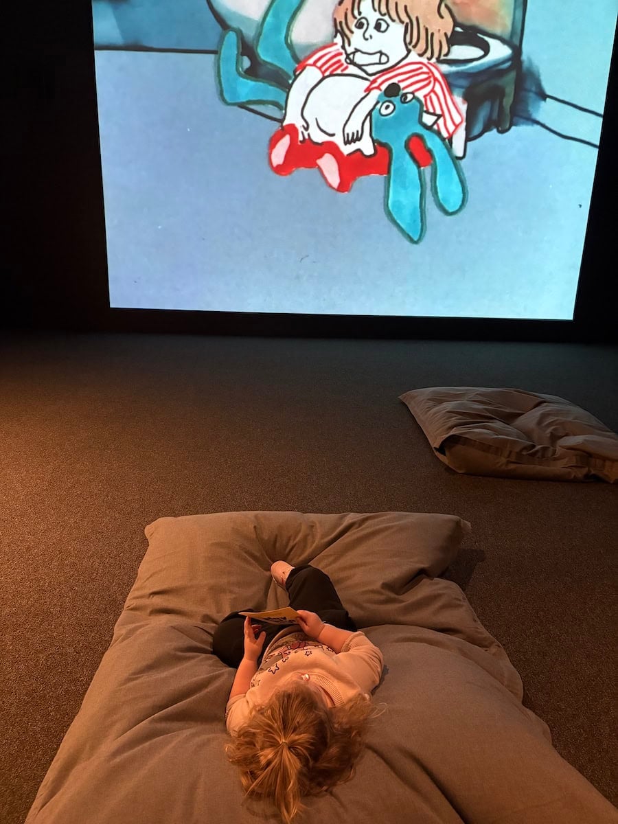 Child watching a film at the walker.