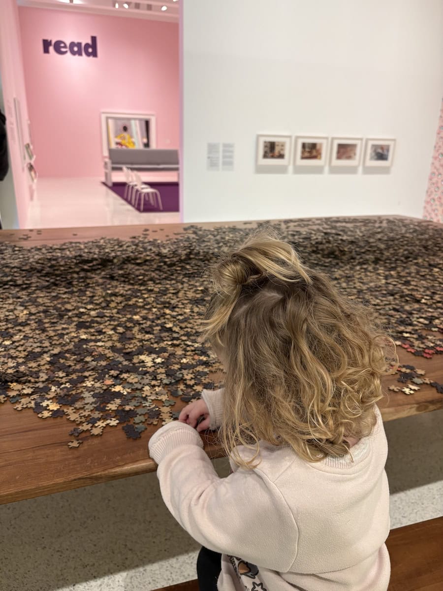 Child working on a puzzle at the walker.