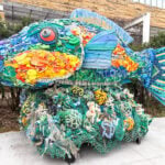 Rainbow Fish Washed Ashore Art Sculpture.