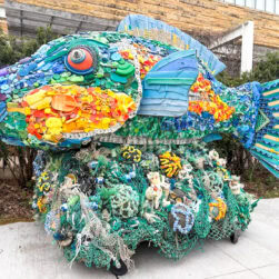 Rainbow Fish Washed Ashore Art Sculpture.