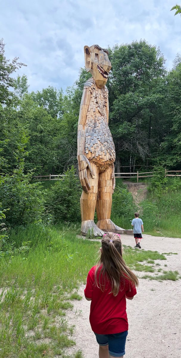 Troll with kids running to it.